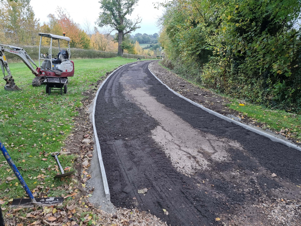 This is a large driveway which is in the process of having a tar and chip driveway installed on by Harleston Driveway Installers