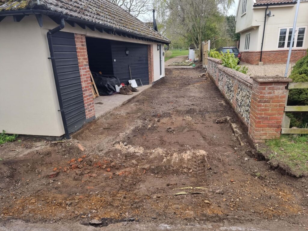 This is a tarmac driveway that is in the process of being dug out and installed byThis is a photo of newly installed chip and tar drive by Harleston Driveway Installers